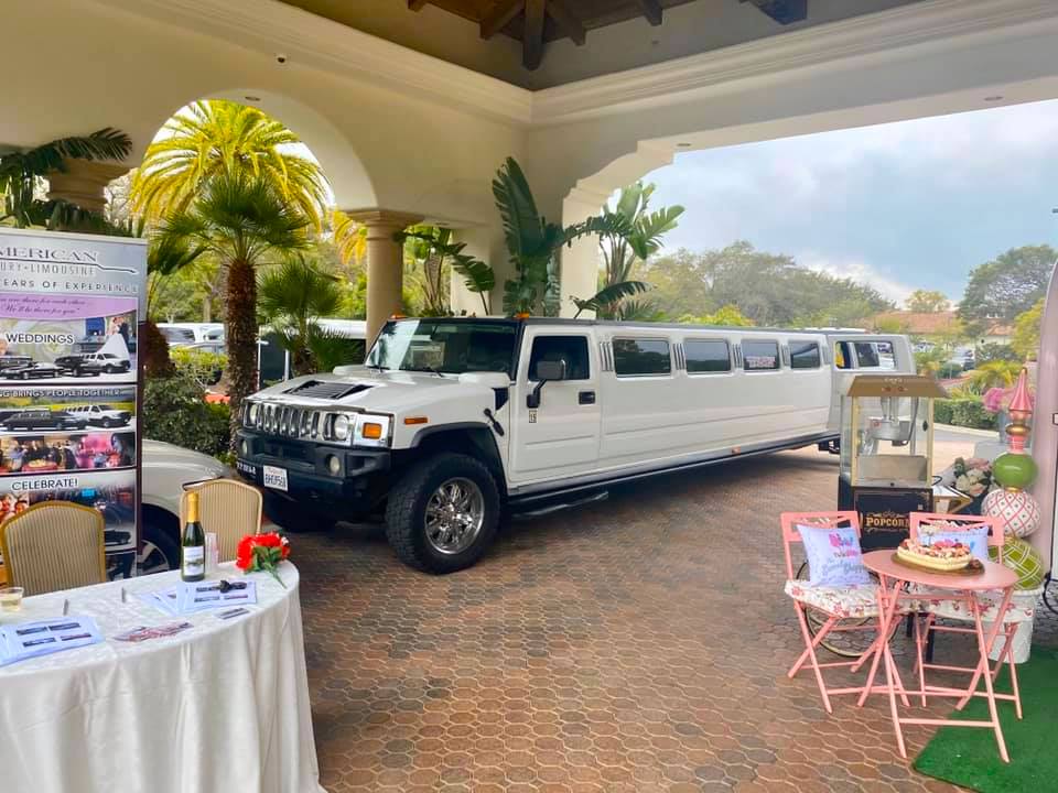 luxury lemousin parked outside a wedding hall with car in hire kochi